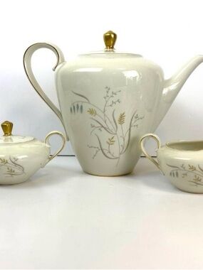 Elegant Cream Porcelain Tea Set with Gold Accents